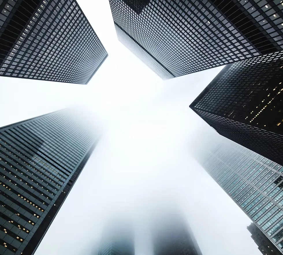 Architectural view looking upward between glass towers